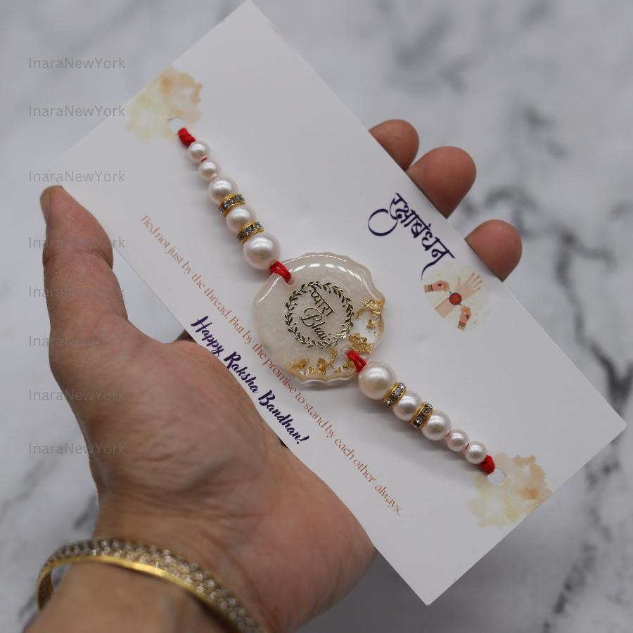 Resin Rakhi with Pearls & Gold Flakes — Elegant Raksha Bandhan Rakhi with Gift Packaging