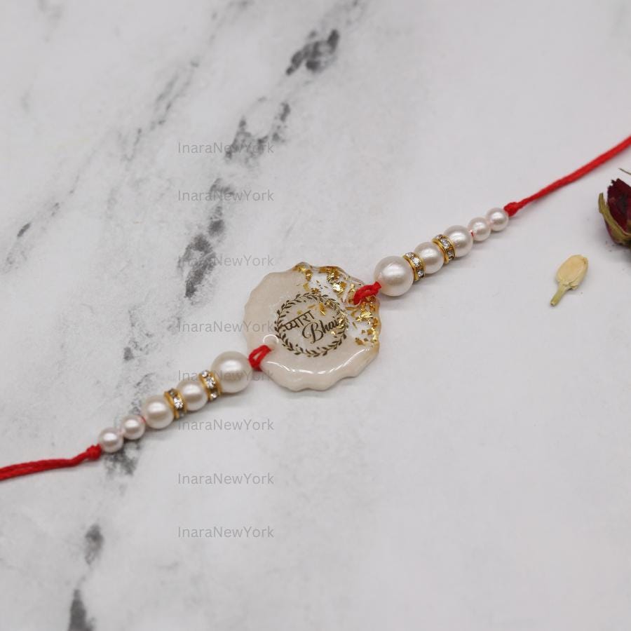 Resin Rakhi with Pearls & Gold Flakes — Elegant Raksha Bandhan Rakhi with Gift Packaging