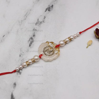 Resin Rakhi with Pearls & Gold Flakes — Elegant Raksha Bandhan Rakhi with Gift Packaging