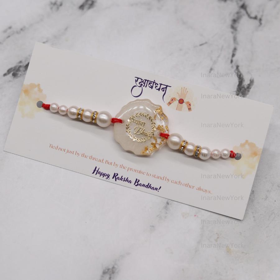 Resin Rakhi with Pearls & Gold Flakes — Elegant Raksha Bandhan Rakhi with Gift Packaging