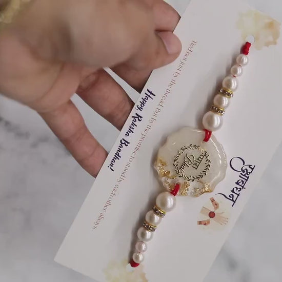 Handmade Resin Rakhi with Pearls & Gold Flakes — Elegant Raksha Bandhan Rakhi with Gift Packaging