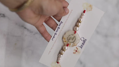 Resin Rakhi with Pearls & Gold Flakes — Elegant Raksha Bandhan Rakhi with Gift Packaging